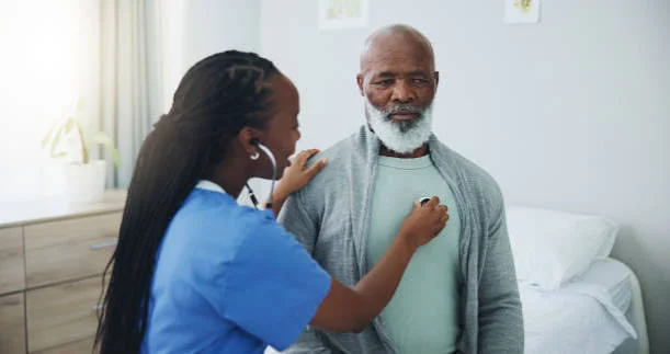 Doctor listening to a patient's heart during a consultation at Nabade Clinic